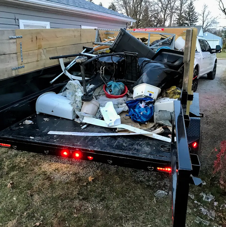 Roll-off dumpster delivered to a residential driveway in Thruston